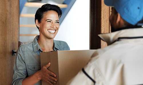 Happy woman receiving birthday package recorded delivery