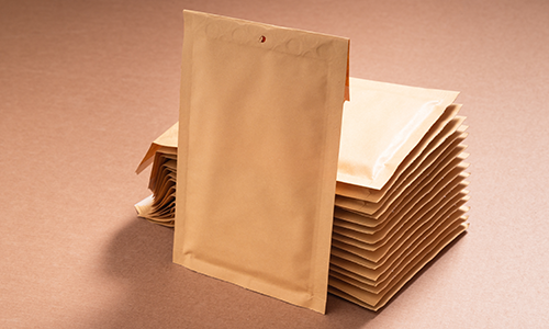 Pack clothing in padded envelope