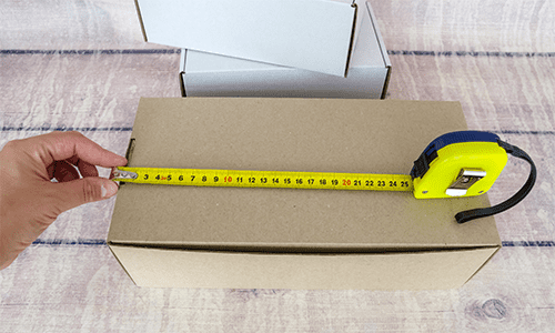 Measure parcel box with tape measure